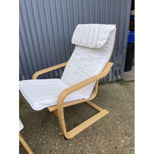 56 - A modern cantilever lounger chair with matching footstool