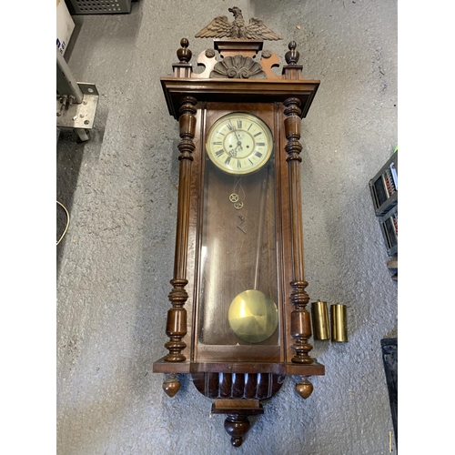 573 - Walnut cased Vienna regulator wall clock, with key, pendulum and weights 130 cms tall