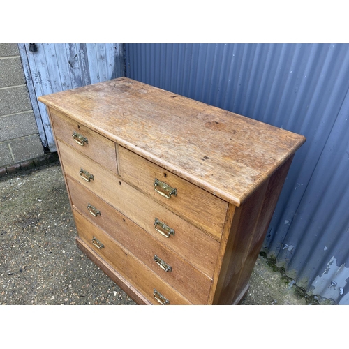 59 - A large antique oak chest of five drawers with brass handles 107x50x1