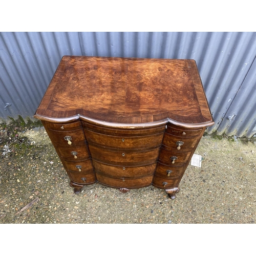 60 - A Queen Anne style walnut bachelors chest of four drawers with brushing slide