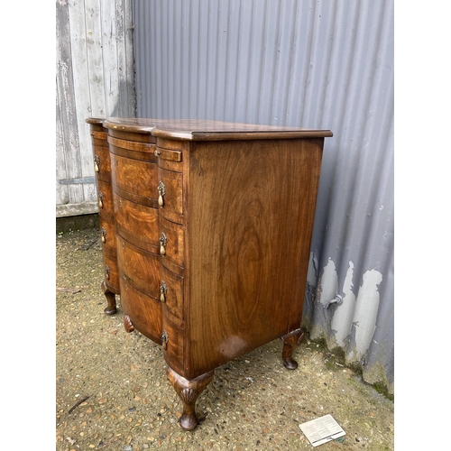 60 - A Queen Anne style walnut bachelors chest of four drawers with brushing slide