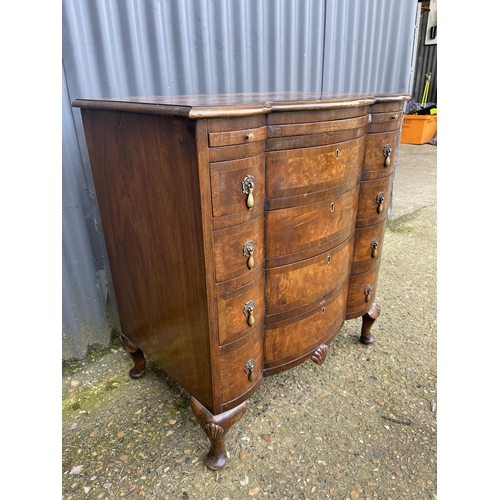 60 - A Queen Anne style walnut bachelors chest of four drawers with brushing slide