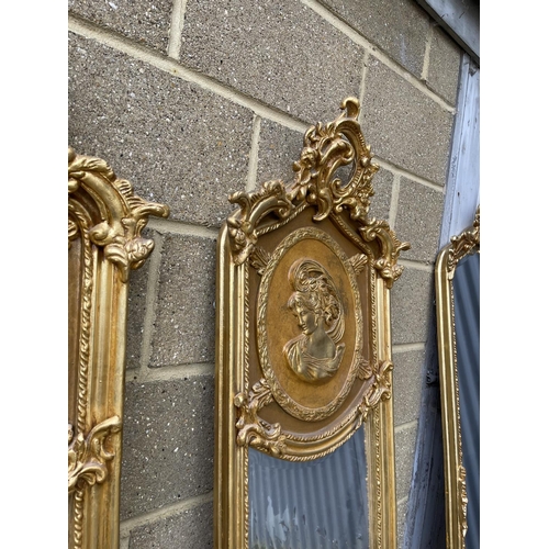 67 - A pair of large gold gilt hallway mirrors with lady decorative panels 180x54