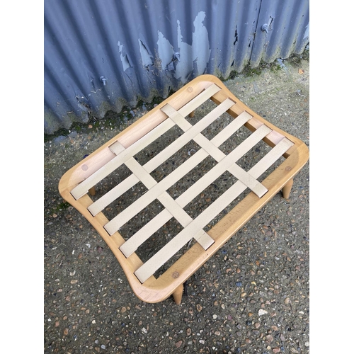 70 - An ercol light elm footstool