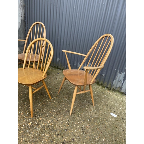 71 - A pair of ercol light elm carver chairs together with an ercol stick back chair