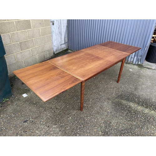 72 - A danish style teak drawer leaf dining table