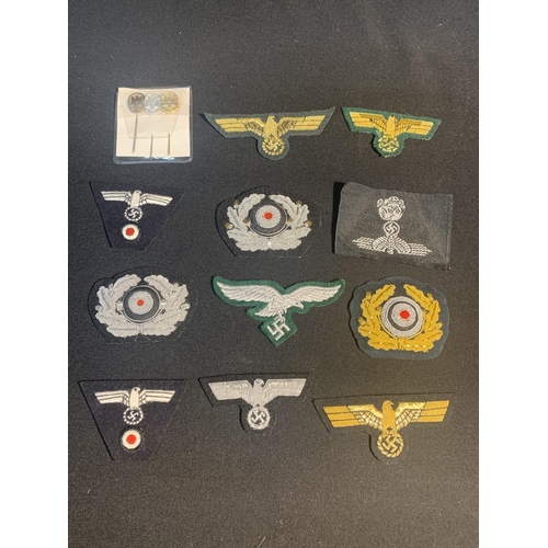 728 - A collection of 14 quality retrospective copies of German Nazi Cap and Breast Badges