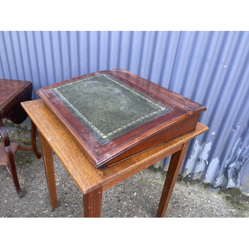 74 - Three mahogany occasional tables, oak table, cake stand, writing slope, nest of two and an oak mirro... 