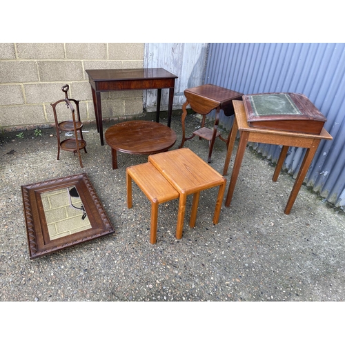 74 - Three mahogany occasional tables, oak table, cake stand, writing slope, nest of two and an oak mirro... 