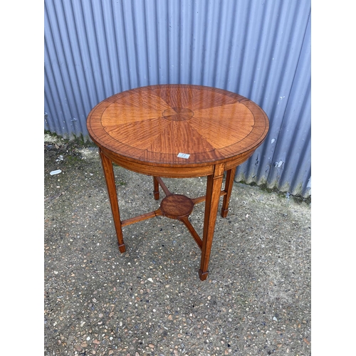 77 - A circular inlaid satinwood occasional table