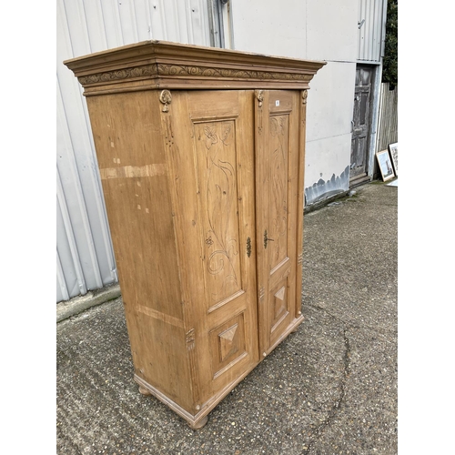 85a - A solid pine continental armoire wardrobe with shelves to the interior
175 cms h x 48 cms deep x 107... 