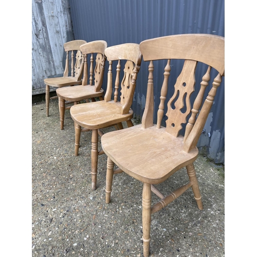 87 - A set of four farmhouse pine dining chairs