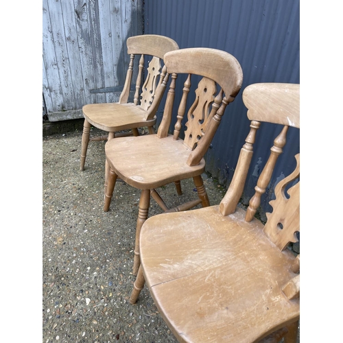 87 - A set of four farmhouse pine dining chairs