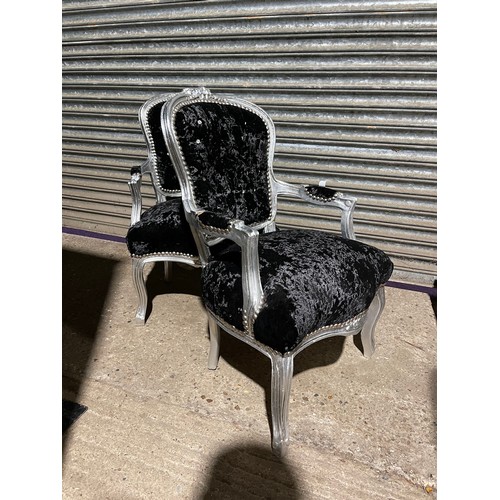 63 - A pair of black crush velvet, silver gilt and diamanté throne style armchairs