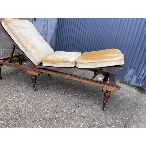 292 - An Edwardian three way adjusting campaign treatment couch, adjusting in three different positions an... 