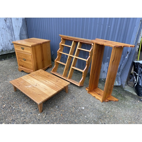 102 - Two solid pine two door cupboards together with a low pine shelf