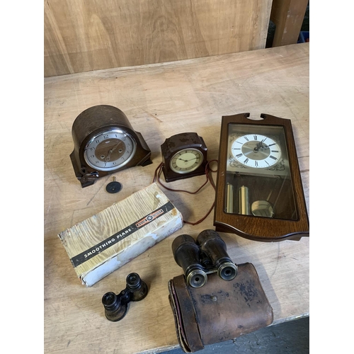 1048 - Three clocks, two pairs of antique binoculars and boxed plane