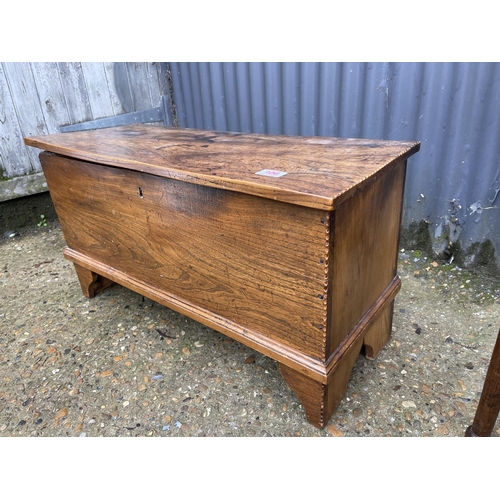 106 - Small oak coffer 75x30x42 together with a circular occasional table