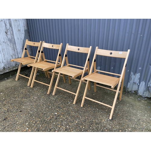 11 - A set of four modern beech folding chairs