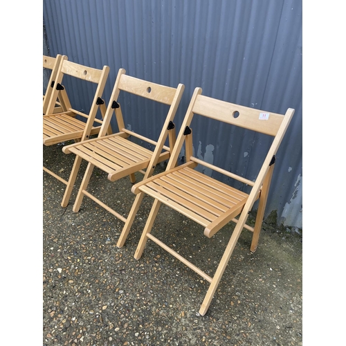 11 - A set of four modern beech folding chairs