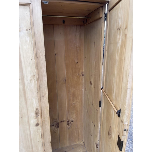 113 - A continental pine three door wardrobe 155x50x205