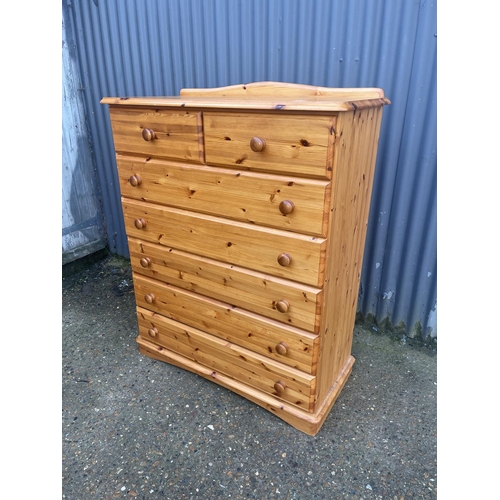 120 - A modern pine tallboy chest of seven drawers 100x47x120