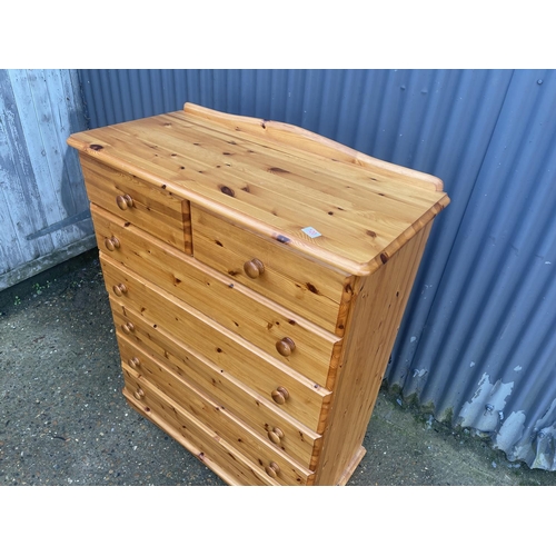 120 - A modern pine tallboy chest of seven drawers 100x47x120