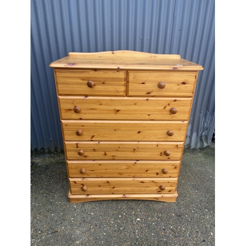 120 - A modern pine tallboy chest of seven drawers 100x47x120