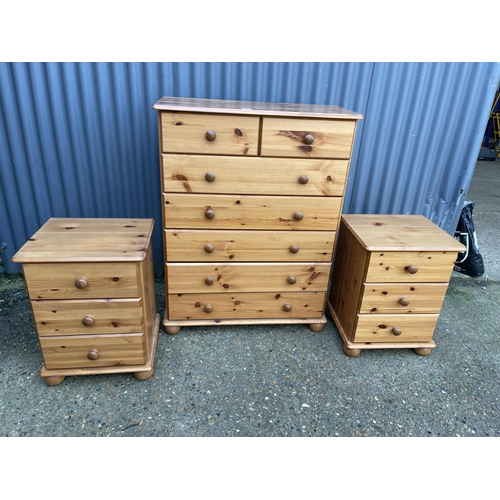 125 - A PINE TALLBOY CHEST OF SEVEN TOGETHER WITH MATCHING BEDSIDES