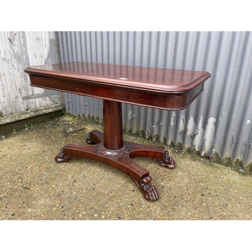 129 - A large victorian mahogany fold over tea table