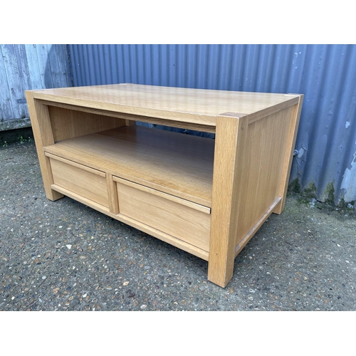 130 - A modern light oak two drawer coffee table 100x 60x50