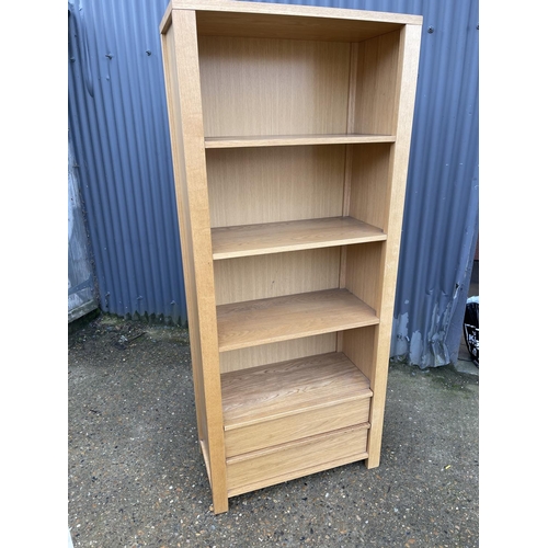 132 - A modern light oak bookcase with two drawers 78x40x183