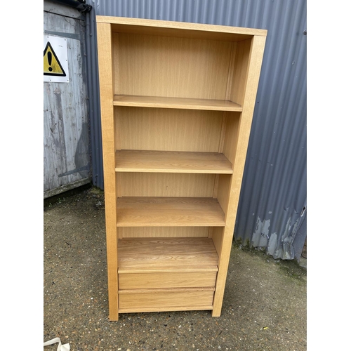 132 - A modern light oak bookcase with two drawers 78x40x183