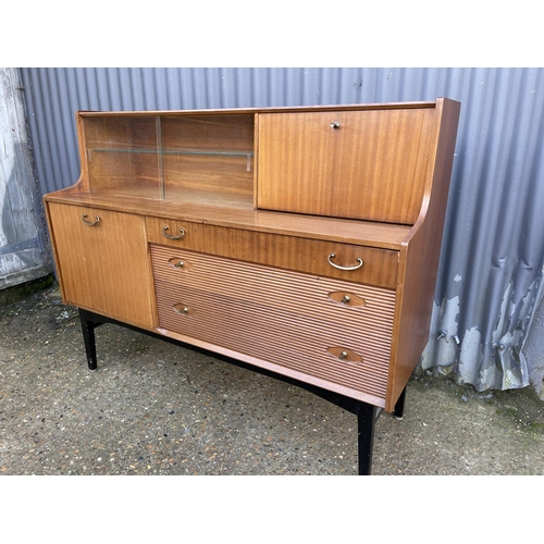 144 - A Avalon or similar teak cocktail sideboard 137cm wide