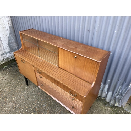 144 - A Avalon or similar teak cocktail sideboard 137cm wide