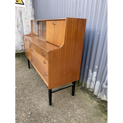 144 - A Avalon or similar teak cocktail sideboard 137cm wide