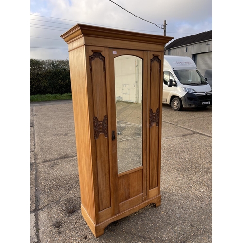 150 - An Edwardian satinwood single door wardrobe 96x54x204