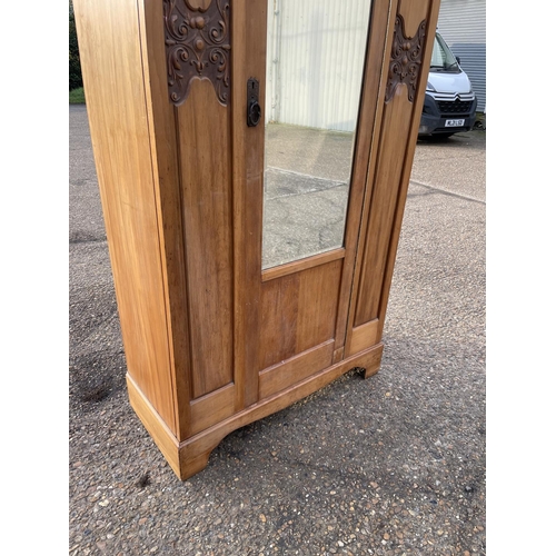 150 - An Edwardian satinwood single door wardrobe 96x54x204