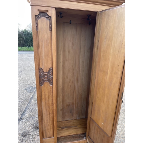 150 - An Edwardian satinwood single door wardrobe 96x54x204