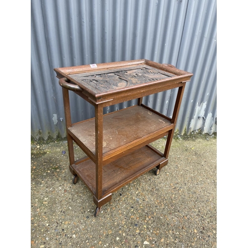 151 - An oriental hardwood three tier trolley