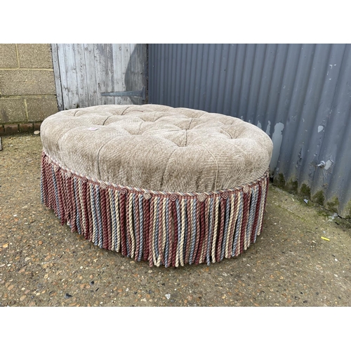 154 - A large oval ottoman / footstool 110x 77