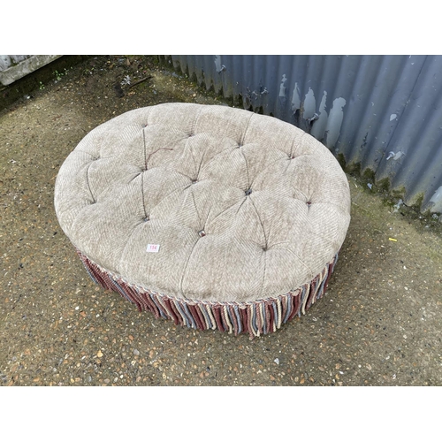 154 - A large oval ottoman / footstool 110x 77