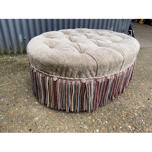 154 - A large oval ottoman / footstool 110x 77