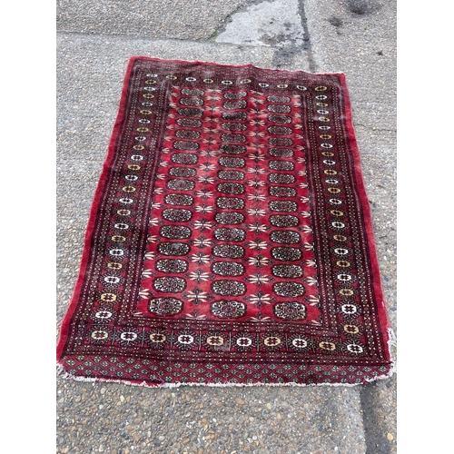 156 - A red oriental pattern rugb126x175