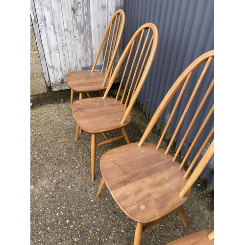 158 - A set of four ercol light elm stick back chairs