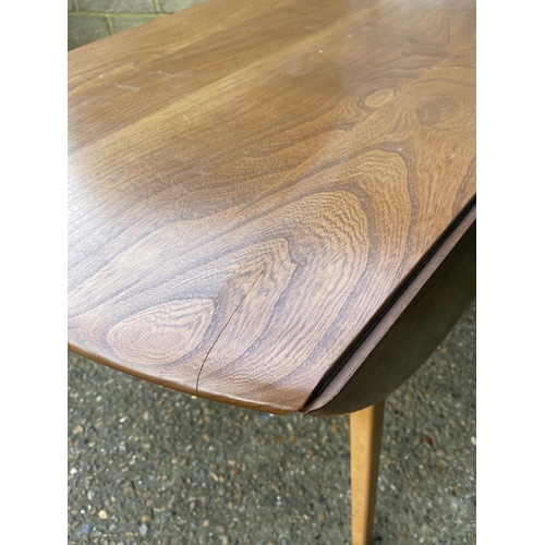 159 - An ercol light elm drop leaf kitchen table