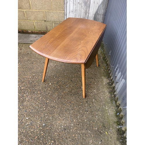 159 - An ercol light elm drop leaf kitchen table