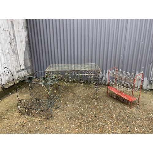 16 - A metalwork table with glass top together with a wirework trolley and a veg rack