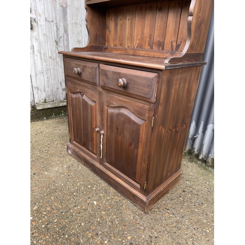 160 - A pine cottage dresser with plate rack top over two drawers and two door base 92x44x200