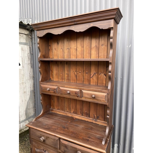 160 - A pine cottage dresser with plate rack top over two drawers and two door base 92x44x200